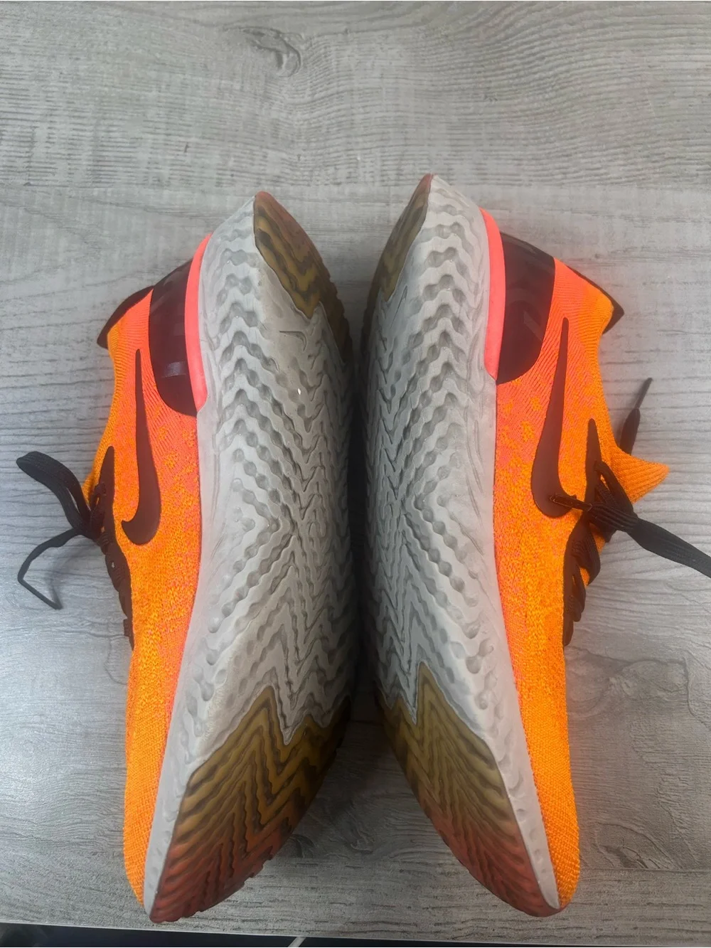 Nike Bright Orange Flyknit Sneakers with Black Accents Women’s Size 10